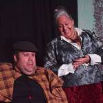 Ian McEwan (left) acts out a scene with Yvette Tappana during a rehearsel for Blazing Guns at Roaring Gulch held Thursday, Aug. 8, 2019, at the Kenai Performers stage in Soldotna. (Photo by Joey Klecka/Peninsula Clarion)