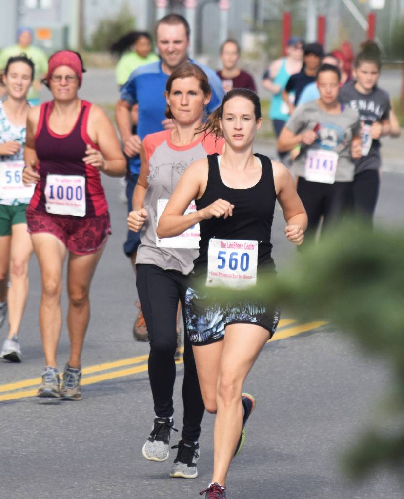 Womens 5K winner Mallory Millay (560) bides her time early on Saturday, Aug. 10, 2019, at the 32nd annual Run for Women in Kenai, Alaska. (Photo by Joey Klecka/Peninsula Clarion)