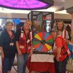From left, American Red Cross volunteers Brenda Chamness, Cindy Rombach, Kathy Heindly and Beth Odom smile for the camera at the Red Cross booth during KidFest at the Peninsula Center Mall in Soldotna, Alaska on Aug. 10, 2019. (Photo by Brian Mazurek/Peninsula Clarion)