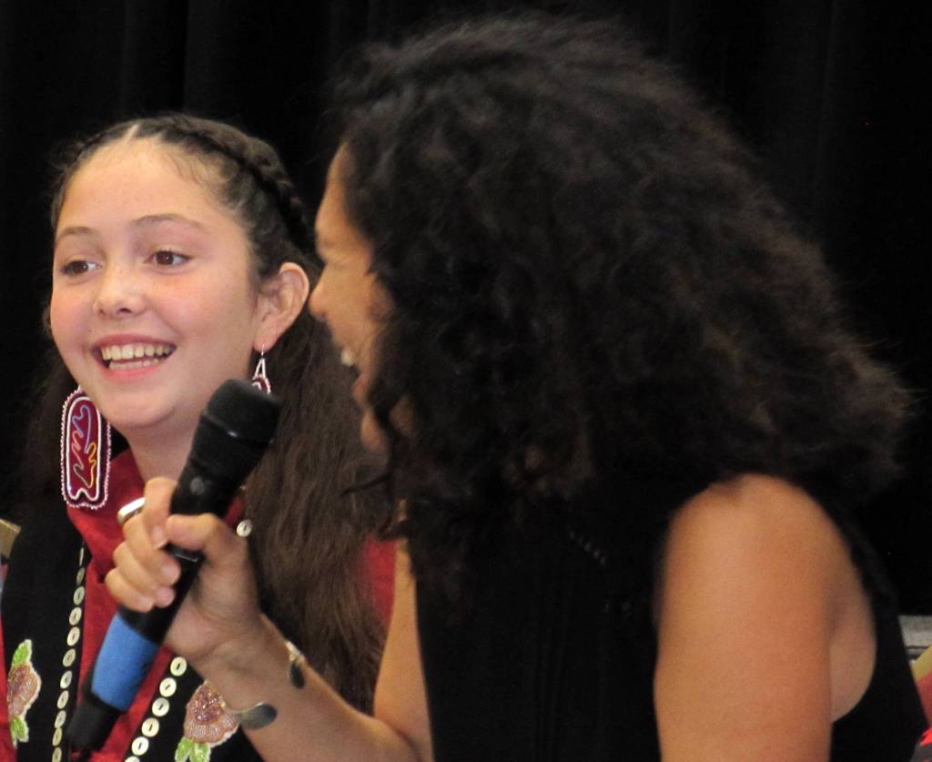 The voice of Molly of Denali Sovereign Bill, who is Tlingit and Muckleshoot, and creative producer Princess Daazhraii Johnson, who is Gwichin, share a laugh during a question-and-answer session at Elizabeth Peratrovich Hall, Saturday, Aug. 11.