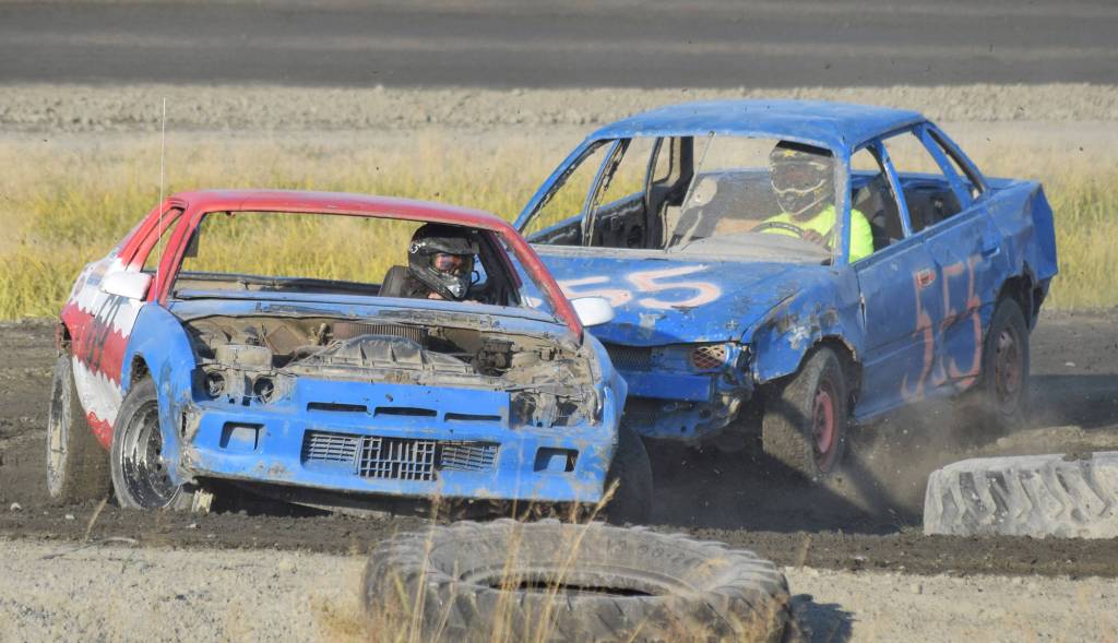 The No. 555 of Johnny Gomulak rears ends the No. 69 of Jett Pace in the Dollar Stock heats Saturday, Aug. 10, 2019, at Twin City Raceway in Kenai, Alaska. (Photo by Joey Klecka/Peninsula Clarion)