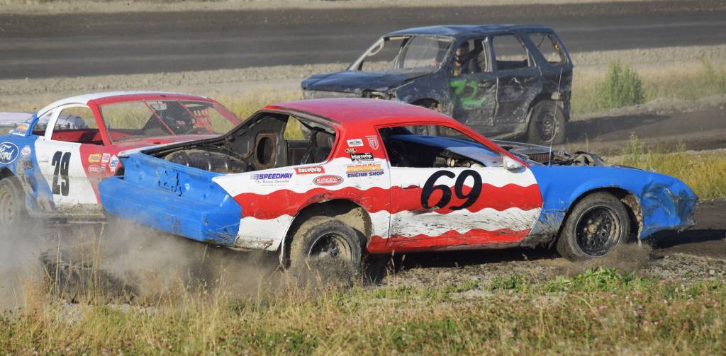 The No. 69 of Jett Pace attempts to save his car after being nudged by the No. 29 of Ryan Gillis Saturday, Aug. 10, 2019, at Twin City Raceway in Kenai, Alaska. (Photo by Joey Klecka/Peninsula Clarion)