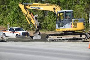 A construction crew excavates along the Kenai Spur Highway in Kenai, Alaska on June 4, 2019. (Photo by Brian Mazurek/Peninsula Clarion)