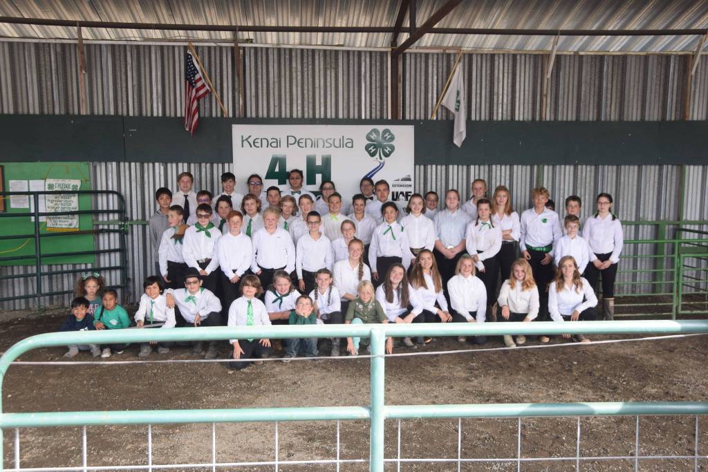 The 4-H kids of the Kenai Peninsula smile for a group photo at the Kenai Peninsula Fair on Saturday, Aug. 17, 2019 at the fairgrounds in Ninilchik, Alaska. (Photo by Brian Mazurek/Peninsula Clarion)