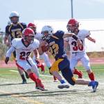 Kachemak-Selo senior and Homer runningback Antonin Maruchev looks for a place to go while under pressure from the Kenai Kardinals during a Saturday, Aug. 17, 2019 football game at Homer High School in Homer, Alaska. (Photo by Megan Pacer/Homer News)