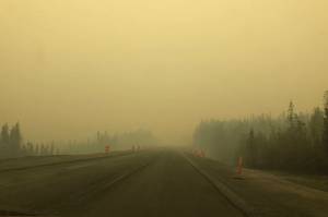 Smoke from the Swan Lake Fire impairs visibility on the Sterling Highway, Alaska, on Aug. 20, 2019. (Photo by Victoria Petersen/Peninsula Clarion)