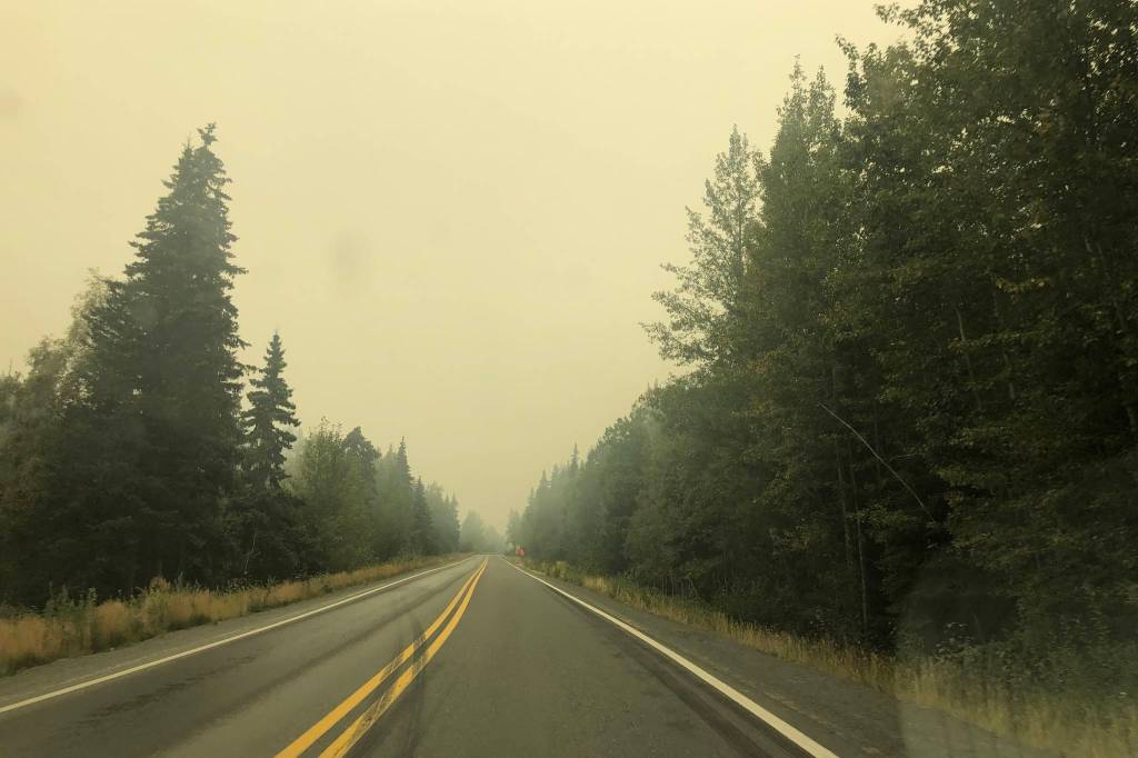 Smoke from the Swan Lake Fire impairs visibility on the Sterling Highway on Aug. 20, 2019. (Photo by Victoria Petersen/Peninsula Clarion)