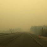 Smoke from the Swan Lake Fire impairs visibility on the Sterling Highway on Aug. 20, 2019. (Photo by Victoria Petersen/Peninsula Clarion)