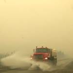 A truck on the Sterling Highway plows through ash produced by the Swan Lake Fire on Aug. 20, 2019. (Photo by Victoria Petersen/Peninsula Clarion)