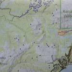 A map shows the Caribou Lake Fire, in red, in relationship to nearby communities and cabins. It was part of a community meeting held on Saturday, Aug. 24, 2019, at a McNeil Canyon Elementary School near Fritz Creek, Alaska. (Photo by Michael Armstrong/Homer News)