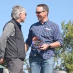 Brian Mazurek / Peninsula Clarion                                Rep. Ben Carpenter (left) , R-Nikiski, presents an award Saturday to Jerry Dzugan, executive director of the Alaska Marine Safety Education Association, for the organizations outstanding support of the commercial fishing industry during Industry Appreciation Day in Kenai.