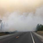 Fire activity can be seen on the Sterling Highway on Sunday, Aug. 26, 2019. (Photo courtesy of the Kenai Peninsula Borough Office of Emergency Management)