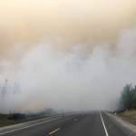 Fire activity can be seen on the Sterling Highway on Sunday, Aug. 26, 2019. (Photo courtesy of the Kenai Peninsula Borough Office of Emergency Management)
