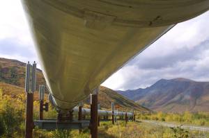 In this undated file photo showing the 800-mile Trans-Alaska pipeline that feeds 950,000 barrels of oil a day to the West Coast snakes it way across the tundra north of Fairbanks, Alaska. BP, a major player on Alaskas North Slope for decades, is selling all of its assets in the state, the company announced Tuesday, Aug. 27, 2019. Hilcorp Alaska is purchasing BP interests in both the Prudhoe Bay oil field and the trans-Alaska pipeline for $5.6 billion, BP announced in a release. (AP Photo/Al Grillo, File)