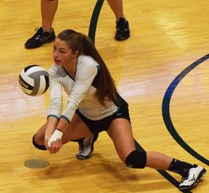 Nikiskis Kaitlyn Johnson dives for a dig Nov. 10, 2018, in the Class 3A state volleyball championship final against Valdez at the Alaska Airlines Center. (Photo by Joey Klecka/Peninsula Clarion)