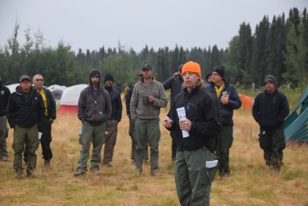 Incident Commander Marty Adell gives the morning briefing at the Otter Creek Spike Camp 5 miles north of Sterling, Alaska on Aug. 30, 2019. (Photo by Brian Mazurek/Peninsula Clarion)