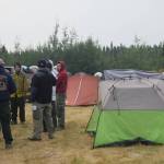 Firefighters discuss the days operations during their division breakout meeting at the Otter Creek Spike Camp 5 miles north of Sterling, Alaska on Aug. 30, 2019. After the general morning briefing, firefighters meet with their division supervisor to discuss more specifics for the area of the fire to which they are assigned, which is known as a division breakout. (Photo by Brian Mazurek/Peninsula Clarion)