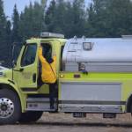 Firefighters load up a tanker from the Nikiski Fire Department at the Otter Creek Spike Camp 5 miles north of Sterling, Alaska on Aug. 30, 2019. (Photo by Brian Mazurek/Peninsula Clarion)