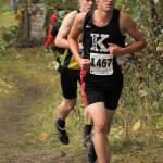 Kenais Nathan Haakenson competes during the Division II boys race of the Palmer Invitational. He is in front of Sewards Max Pfeiffenberger. (Photo by Tim Rockey/Frontiersman)