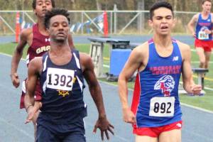 Homers Eyoab Knapp sprints the final stretch of the Division II boys race of the Palmer Invitational. Knapp finished seventh. (Photo by Tim Rockey/Frontiersman)