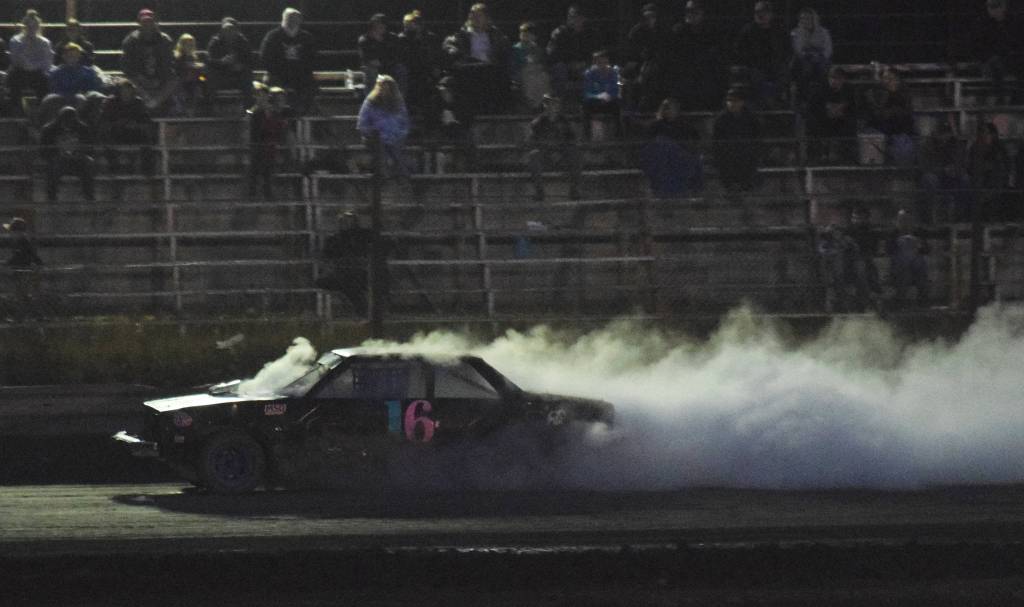The engine in Gracie Bass A-Stock racer expires in spectacular fashion Friday, Sept. 6, 2019, at Twin City Raceway in Kenai, Alaska. (Photo by Joey Klecka/Peninsula Clarion)