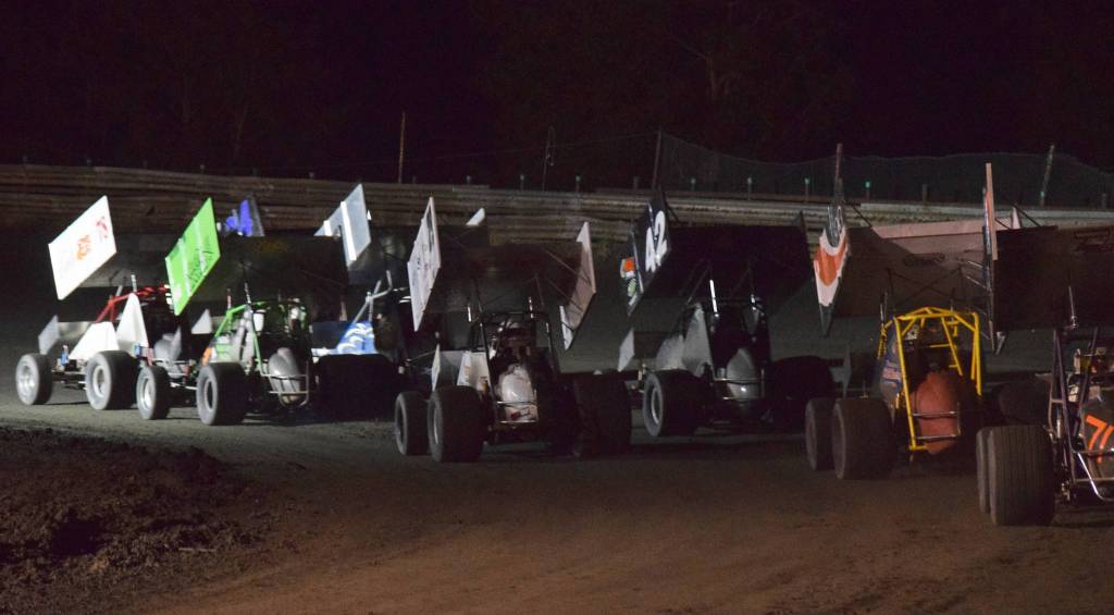 A field of 10 Sprint Cars prepare to take the green flag Friday, Sept. 6, 2019, at Twin City Raceway in Kenai, Alaska. (Photo by Joey Klecka/Peninsula Clarion)