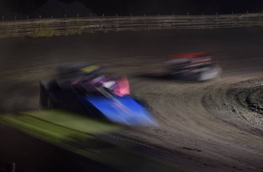 The field of Late Models slide through a turn Friday, Sept. 6, 2019, at Twin City Raceway in Kenai, Alaska. (Photo by Joey Klecka/Peninsula Clarion)