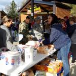Volunteers serve food to peninsula residents and first responders during the first responder appreciation barbecue at Soldotna Creek Park on Monday, Sept. 9, 2019 in Soldotna, Alaska. (Photo by Brian Mazurek/Peninsula Clarion)