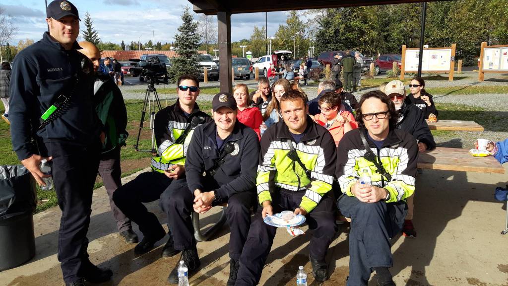 Peninsula residents and firefighters enjoy a meal together during the first responder appreciation barbecue at Soldotna Creek Park on Monday, Sept. 9, 2019 in Soldotna, Alaska. (Photo by Brian Mazurek/Peninsula Clarion)