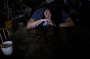 In this Feb. 16, 2019, photo, Deidre Levi rests her head for a moment in her grandmothers house before a basketball game in the Native Village of St. Michael, Alaska. Levi says she spoke up about being sexually assaulted because she wanted to be a role model for girls in Alaska. (AP Photo/Wong Maye-E)