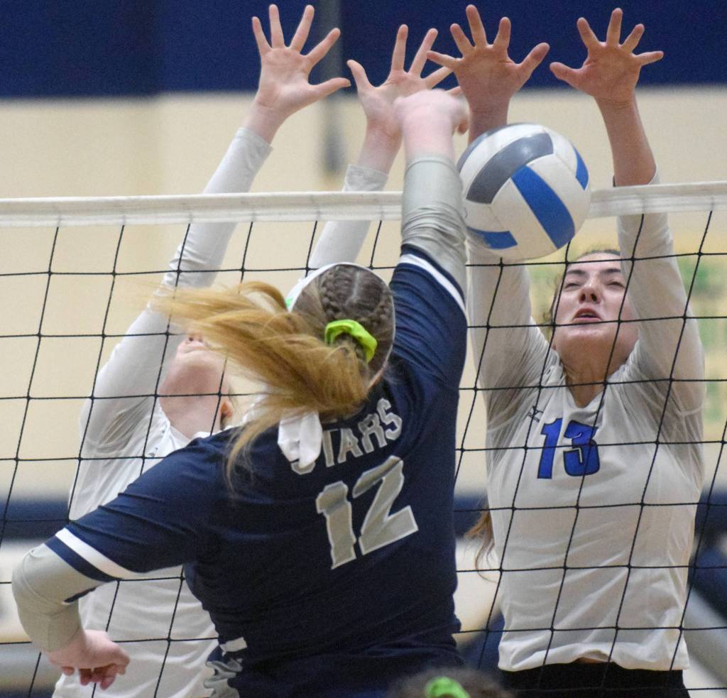 Palmers Deana McNutt and Talia Villnerve block against Soldotnas Bailey Armstrong on Friday, Sept. 13, 2019, at Soldotna High School in Soldotna, Alaska. (Photo by Jeff Helminiak/Peninsula Clarion)