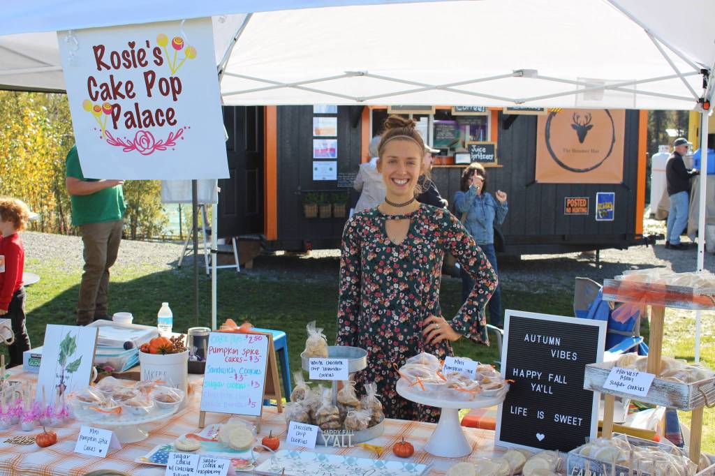 Shelby Dykstra of Rosies Cake Pop Palace shows off her baked goods at the Harvest Moon Local Food Festival at Soldotna Creek Park on Sept. 14, 2019. (Photo by Brian Mazurek/Peninsula Clarion)