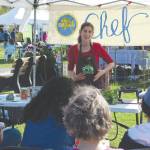 Brian Mazurek / Peninsula Clarion                                Eliza Eller with the Kenai Local Food Connection gives a class on making Kimchi at the Harvest Moon Local Food Festival at Soldotna Creek Park on Saturday.