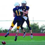 Homers Johsh Bradshaw (No. 11) and Cade Hrenchir celebrate Hrenchirs touchdown during a Friday, Sept. 13, 2019 football game against Valdez High School on the Mariner field in Homer, Alaska. (Photo by Megan Pacer/Homer News)
