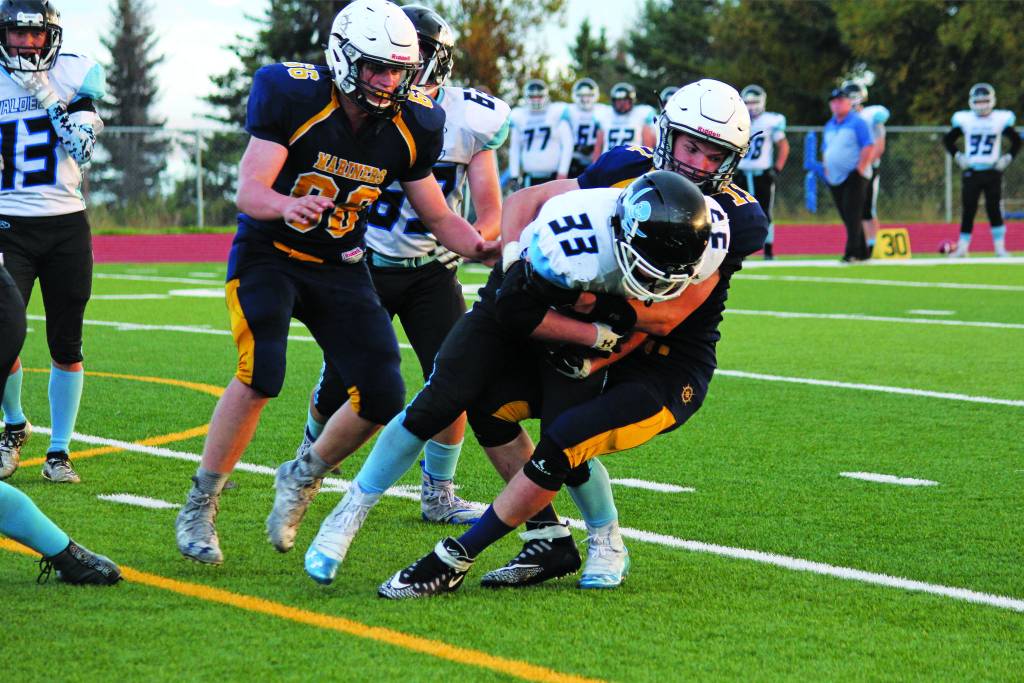 Homers Josh Bradshaw tackles Hayden Howard of Valdez High School during a Friday, Sept. 13, 2019 football game between the two teams at Homer High School in Homer, Alaska. (Photo by Megan Pacer/Homer News)