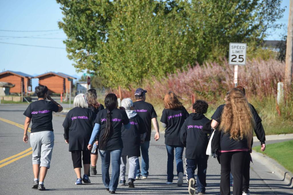 Participants in the You Matter. L;ve Suicide Awareness and Prevention Walk can be seen here walking through Old Town Kenai on Saturday, Sept. 14, 2019. (Photo by Brian Mazurek/Peninsula Clarion)