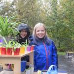 Piper Bloom, left, and Alyssa Deraeve, right, at the Montessori Farmers Market at the Soldotna Montessori School on Sept. 13, 2019. (Photo by Brian Mazurek/Peninsula Clarion)
