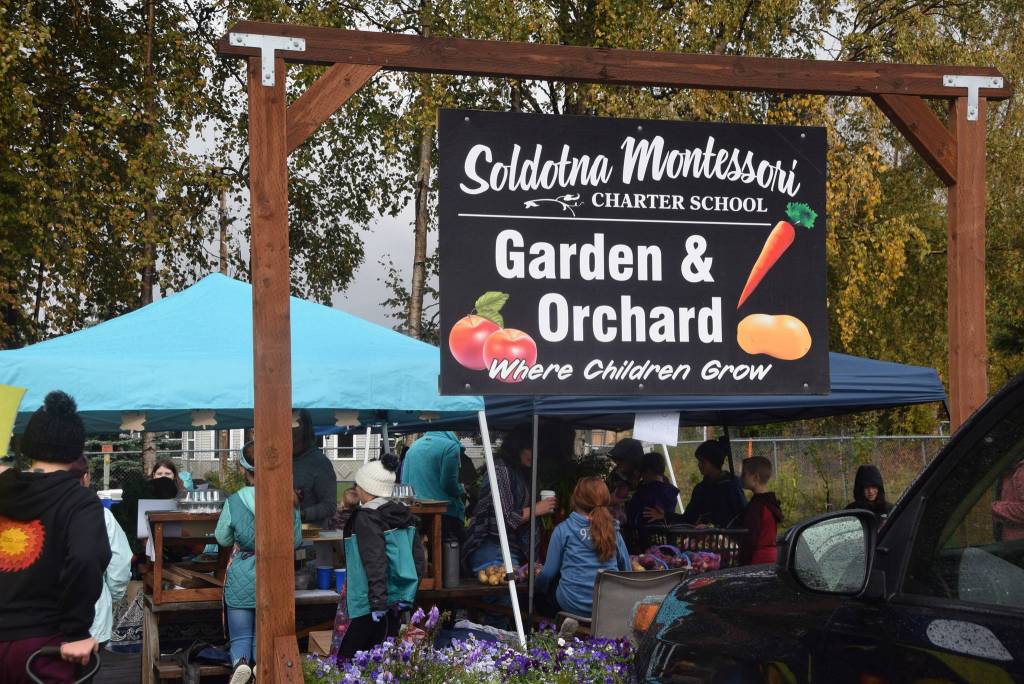 The sign for the Soldotna Montessori garden can be seen here during the Montessori Farmers Market on Sept. 13, 2019. (Photo by Brian Mazurek/Peninsula Clarion)