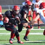 Kenai Central running back Zach Burnett looks for a gap Saturday, Sept. 14, 2019, against West Valley at Ed Hollier Field in Kenai, Alaska. (Photo by Joey Klecka/Peninsula Clarion)