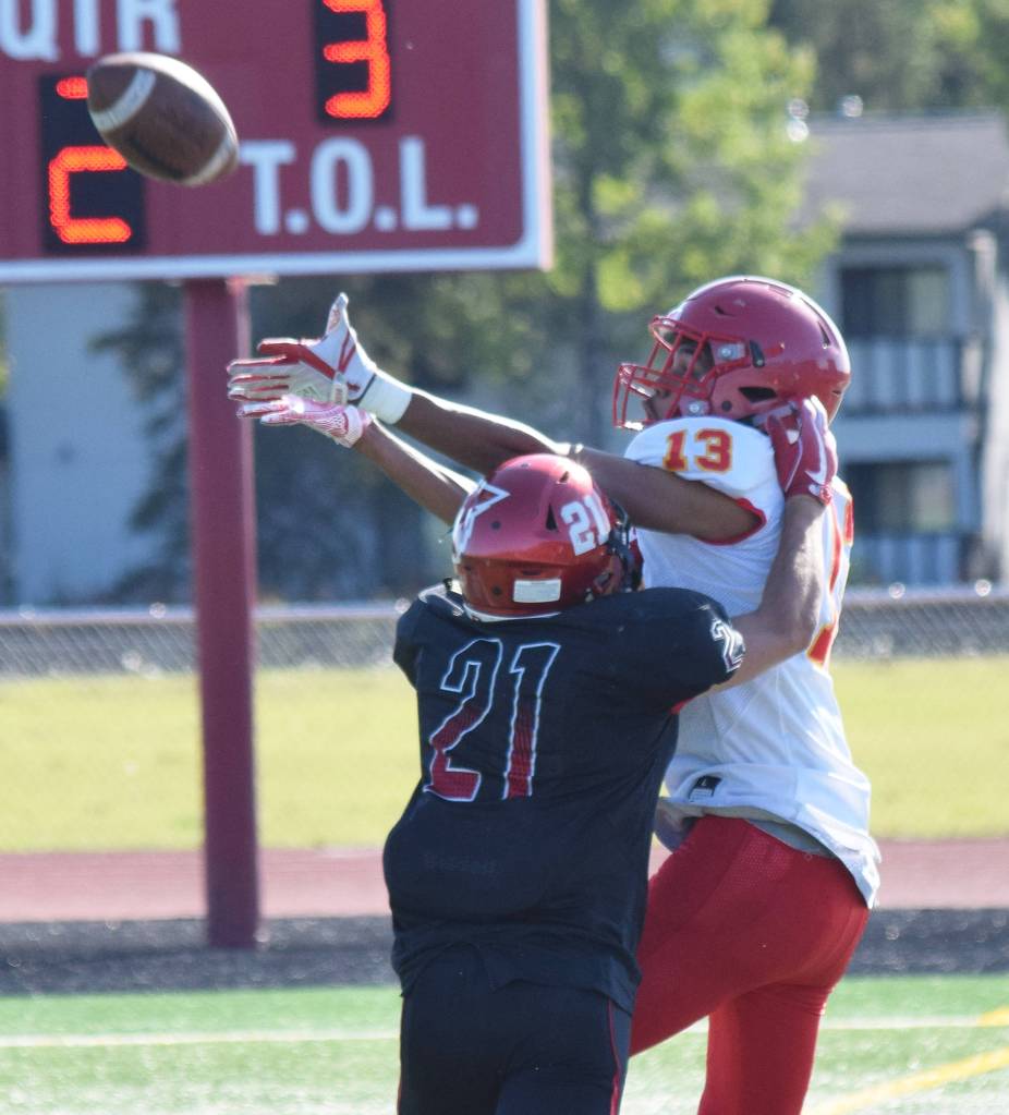 West Valley receiver Tyriq Nance hauls in a reception over Kenai Central defender Zach Burnett, Saturday, Sept. 14, 2019, at Ed Hollier Field in Kenai, Alaska. (Photo by Joey Klecka/Peninsula Clarion)