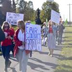 Educators hold signs and rally in front of Kenai Central High School near the Kenai Spur Highway, after school, on Monday, Sept. 16, 2019, in Kenai, Alaska. (Photo by Victoria Petersen/Peninsula Clarion)