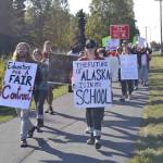 One day before a planned educator strike, teachers and staff rally in front of Kenai Central High School, on Monday, Sept. 16, 2019, in Kenai, Alaska. (Photo by Victoria Petersen/Peninsula Clarion)