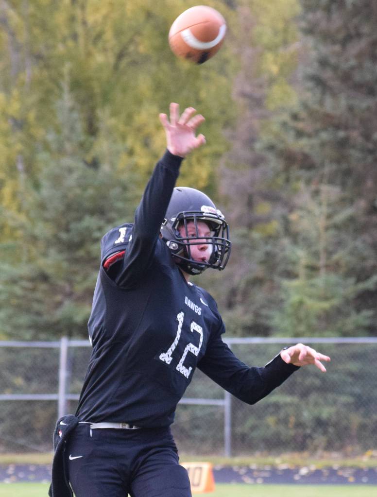 Nikiski quarterback Noah Litke releases a pass Friday, Sept. 20, 2019, against Houston at Nikiski High School. (Photo by Joey Klecka/Peninsula Clarion)