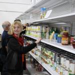 Food bank volunteer Gunnar Peters stocks the shelves at the Kenai Peninsula Food Bank in Soldotna, Alaska on Sept. 20, 2019. (Photo by Brian Mazurek/Peninsula Clarion)