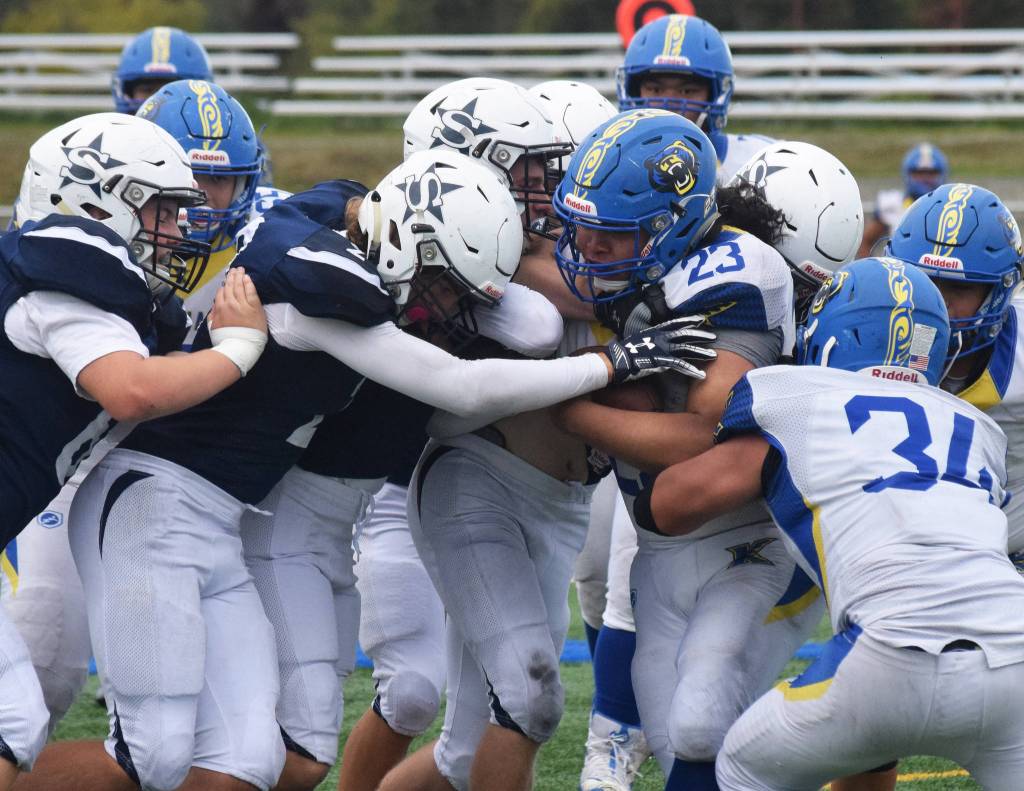 Kodiaks Josue Martinez meets a wall of Soldotna defenders Saturday, Sept. 21, 2019, at Justin Maile Field in Soldotna, Alaska. (Photo by Joey Klecka/Peninsula Clarion)
