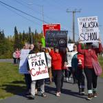 Educators rally in front of Kenai Central High School after school ahead of a strike called on by two employee associations, on Monday, Sept. 16, 2019, in Kenai, Alaska. (Photo by Victoria Petersen/Peninsula Clarion)