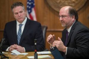 In this Empire File photo, Gov. Mike Dunleavy, left, listens as Attorney General Kevin Clarkson describes three constitutional amendments that would be a foundation of his administrations fiscal plan during a press conference at the Capitol on Wednesday, Jan. 30, 2019. (Michael Penn | Juneau Empire File)