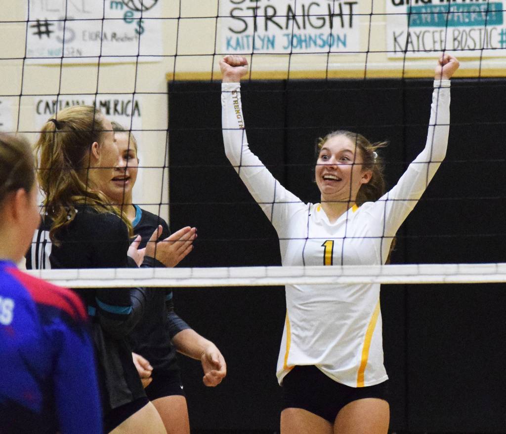 Nikiskis America Jeffreys celebrates a point with her team Friday, Sept. 27, 2019, against ACS at Nikiski High School. (Photo by Joey Klecka/Peninsula Clarion)