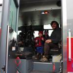 Dakota Hendrickson, Jennifer Hendrickson and Erik Hendrickson check out one of the fire engines during the Central Emergency Services Open House at Fire Station 1 in Soldotna, Alaska on Sept. 28, 2019. (Photo by Brian Mazurek/Peninsula Clarion)