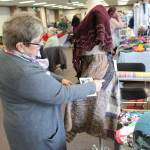 Sharon Koecher shows off a skirt made by her daughter Farrah Weinert during the Fireweed FiberFest at the Soldotna Regional Sports Complex on Sept. 28, 2019. (Photo by Brian Mazurek/Peninsula Clarion)